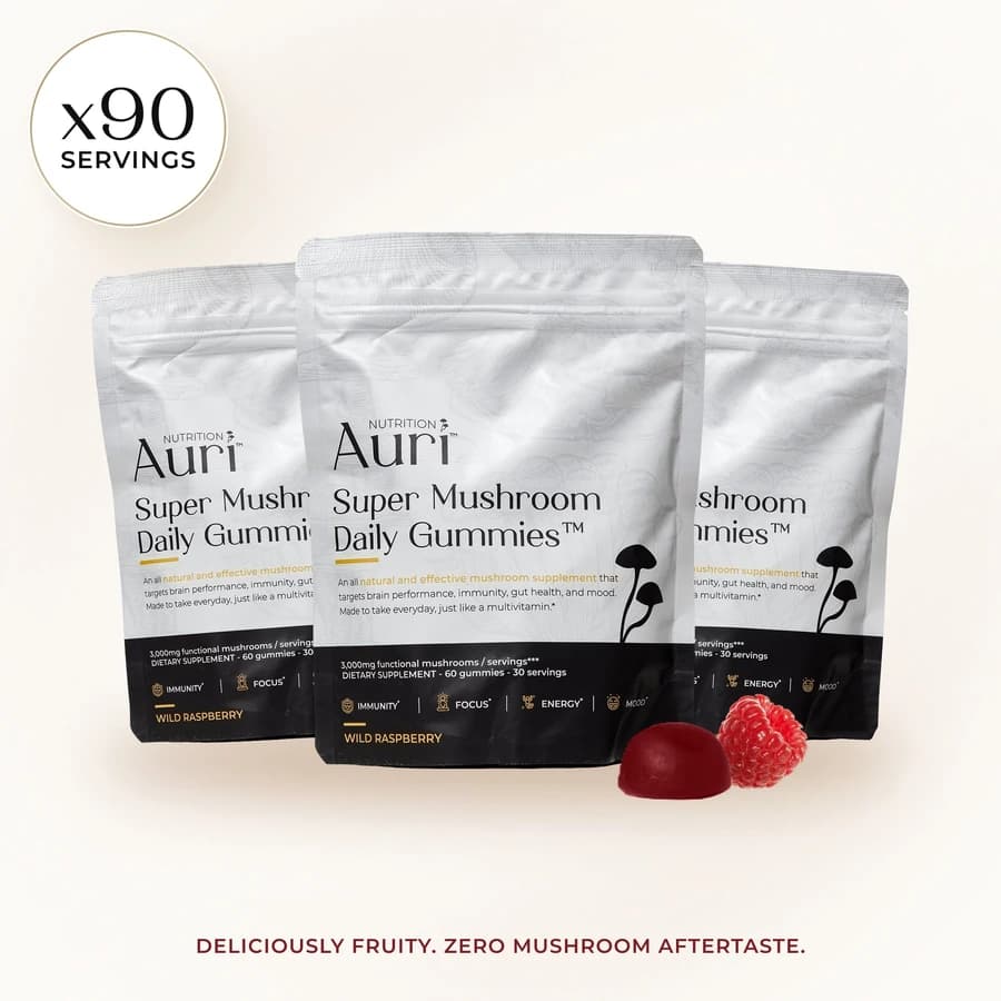 Three Auri Super Mushroom Daily Gummies pouches with red gummies.
