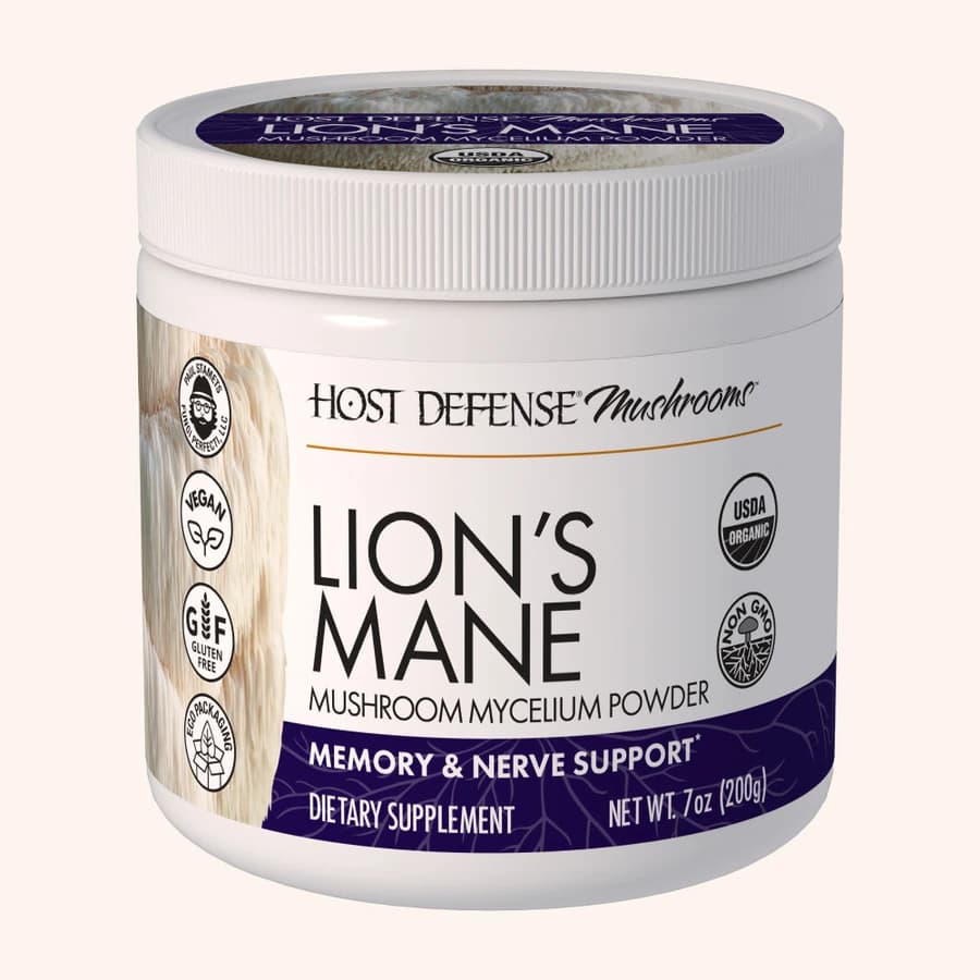 Host Defense Lion's Mane powder jar with a white lid and purple label.