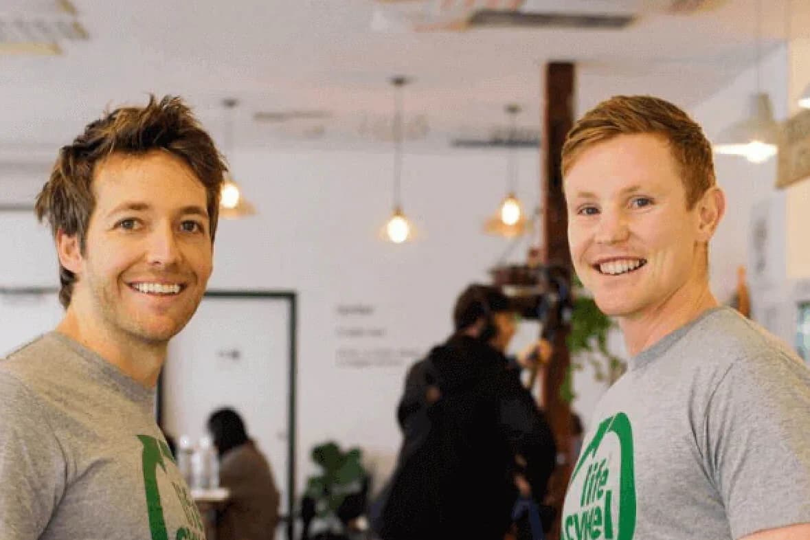 Two people wearing Lifecykel shirts in a brand photograph