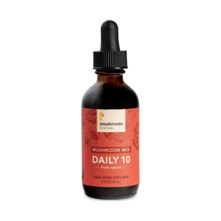 Amber Mushroom Revival Daily 10 Mix tincture bottle with a black dropper and red label.