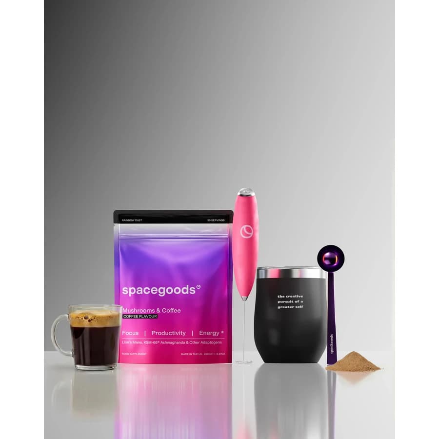 Spacegoods Rainbow Dust Coffee starter kit with a purple pouch, cup, frother and scoop.