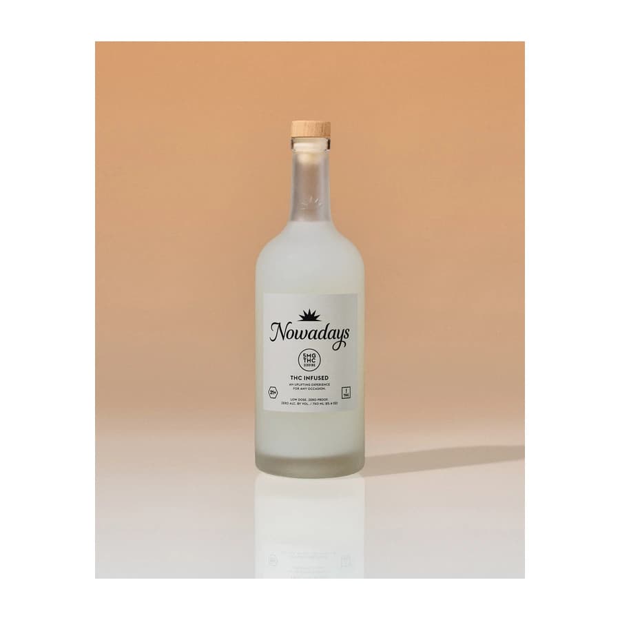 Frosted Nowadays Low Dose 5 mg THC bottle with a wooden cap on a warm beige background.
