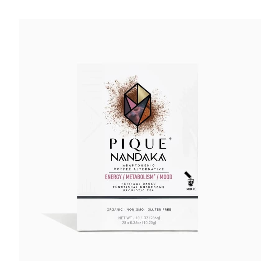 White Pique Nandaka box with a geometric emblem and cacao-colored detail.