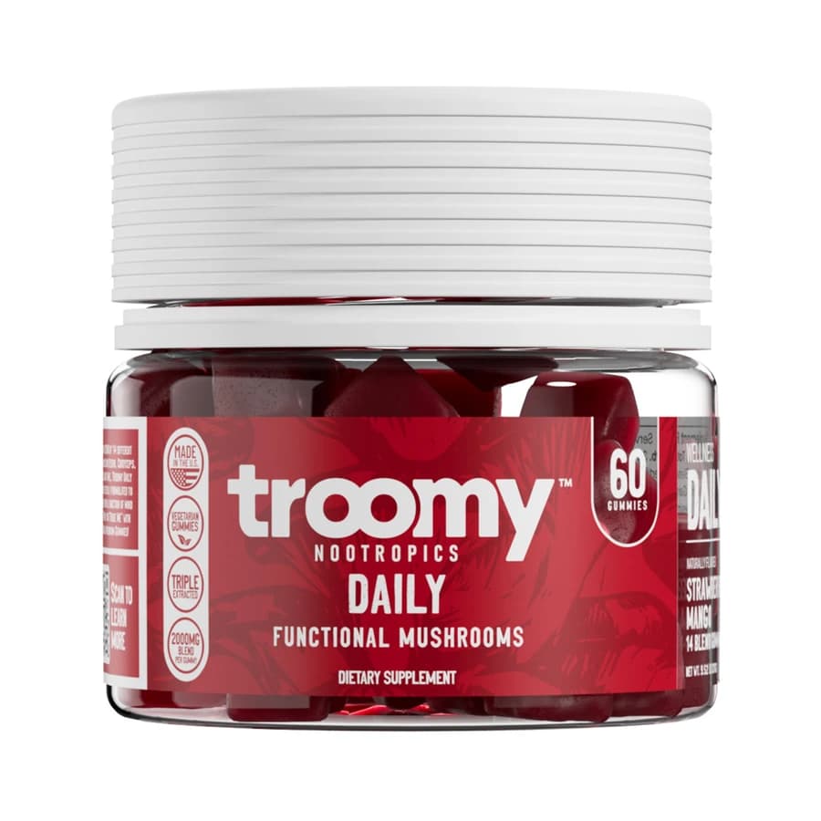Troomy Daily 14 Mushroom Blend gummies jar with a white lid and red label.