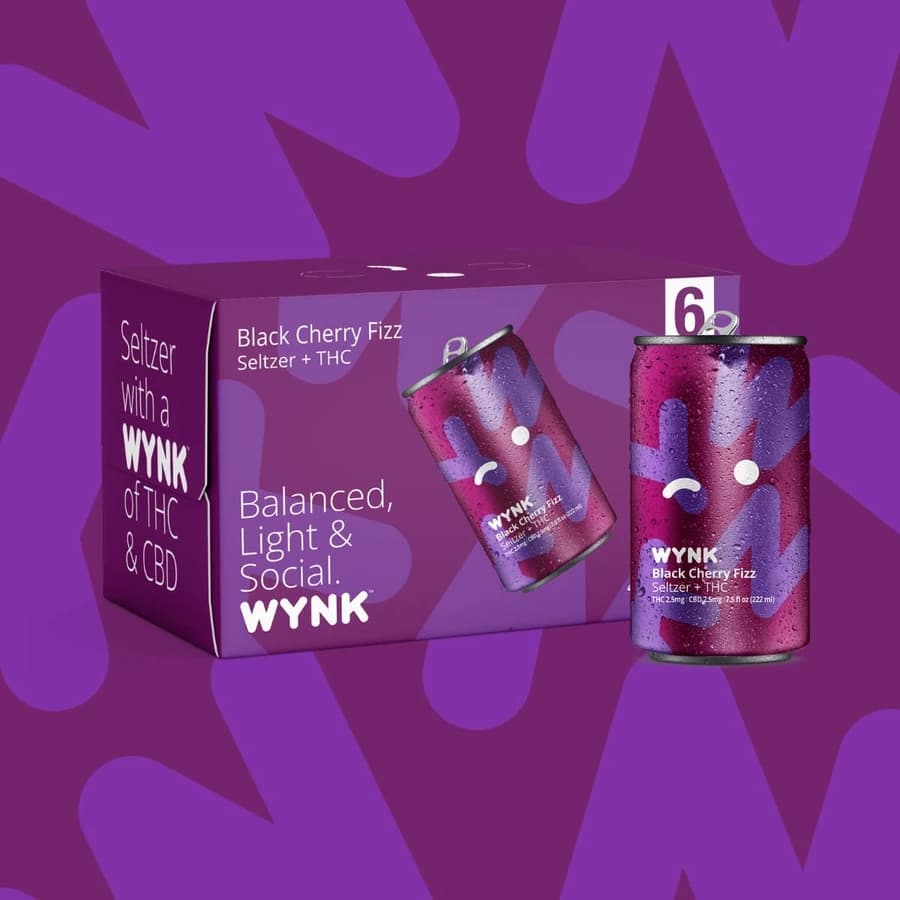 Purple WYNK Black Cherry Fizz seltzer can and matching multipack box.